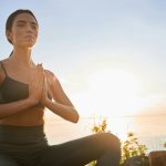 woman practicing mindfulness meditating outside